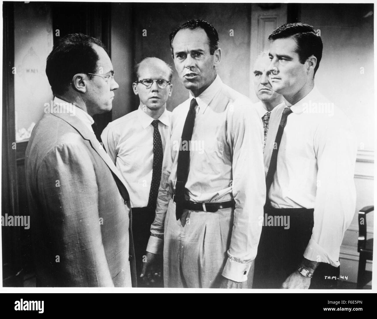 RELEASE DATE: July 29, 1957. MOVIE TITLE: 12 Angry Men. STUDIO: Orion-Nova Productions. PLOT: The defence and the prosecution have rested and the jury is filing into the jury room to decide if a young Spanish-American is guilty or innocent of murdering his father. What begins as an open and shut case of murder soon becomes a mini-drama of each of the jurors' prejudices and preconceptions about the trial, the accused, and each other. Based on the play, all of the action takes place on the stage of the jury room. PICTURED: HENRY FONDA as Juror Stock Photo