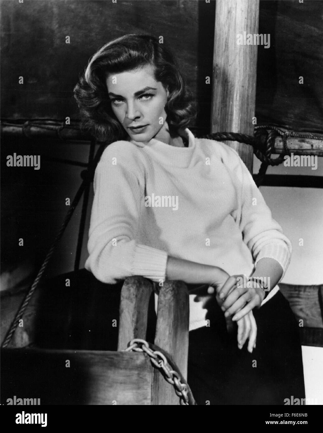 RELEASE DATE: 1955. STUDIO: Warner Brothers. PLOT: A merchant marine captain, rescued from the Chinese Communists by local visitors, isshanghaied into transporting the whole village to Hong Kong on an ancient paddle steamer.  PICTURED: LAUREN BACALL. Stock Photo
