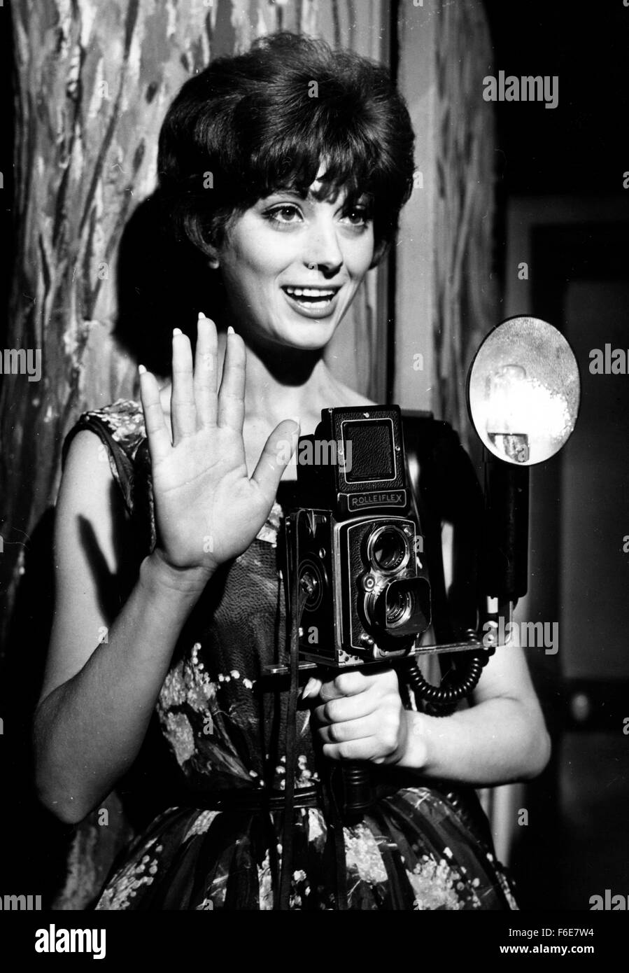 Oct. 2, 1957 - Paris, France - French starlet MARIE HELENE ARNAUD, impersonates a girl press photographer in the film 'Ca aussi, c'est Paris' (It is also Paris) now in the making. PICTURED: Marie Helene with her camera in a scene of the film. (Credit Image: c KEYSTONE Pictures USA) Stock Photo