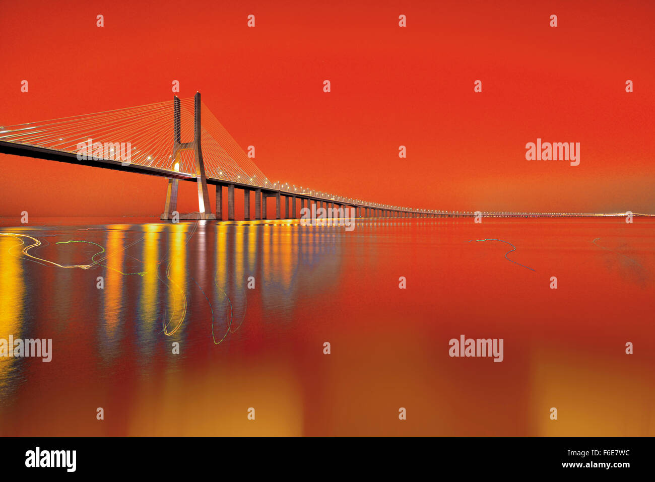 Portugal: Nocturnal view with scenic sky of bridge Ponte Vasco da Gama in Lisbon Stock Photo