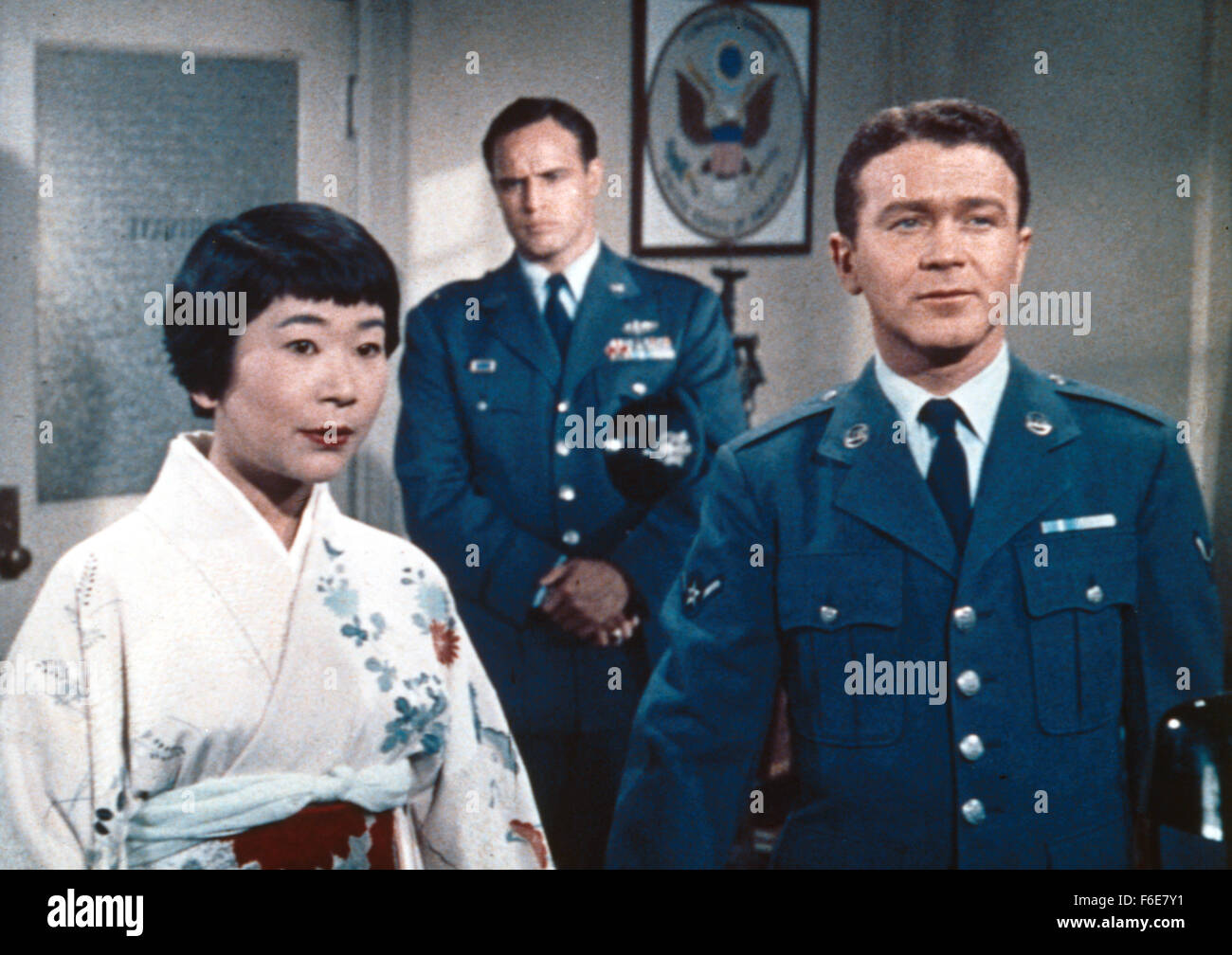 RELEASE DATE: December 5, 1957. MOVIE TITLE: Sayonara. STUDIO: Pennebaker Productions. PLOT: Major Lloyd Gruver, a Korean War flying ace reassigned to Japan, staunchly supports the military's opposition to marriages between American troops and Japanese women. But that's before Gruver experiences a love that challenges his own deeply set prejudices... and plunges him into conflict with the U.S. Air Force and Japan's own cultural taboos. PICTURED: MARLON BRANDO as Maj. Lloyd 'Ace' Gruver, MIYOSHI UMEKI as Katsumi and RED BUTTONS as Airman Joe Kelly. Stock Photo