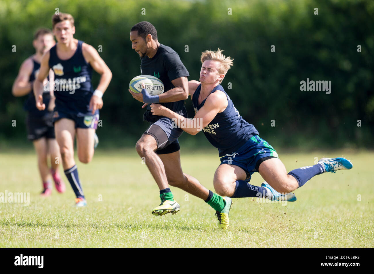 Rugby player making diving tackle Stock Photo Alamy