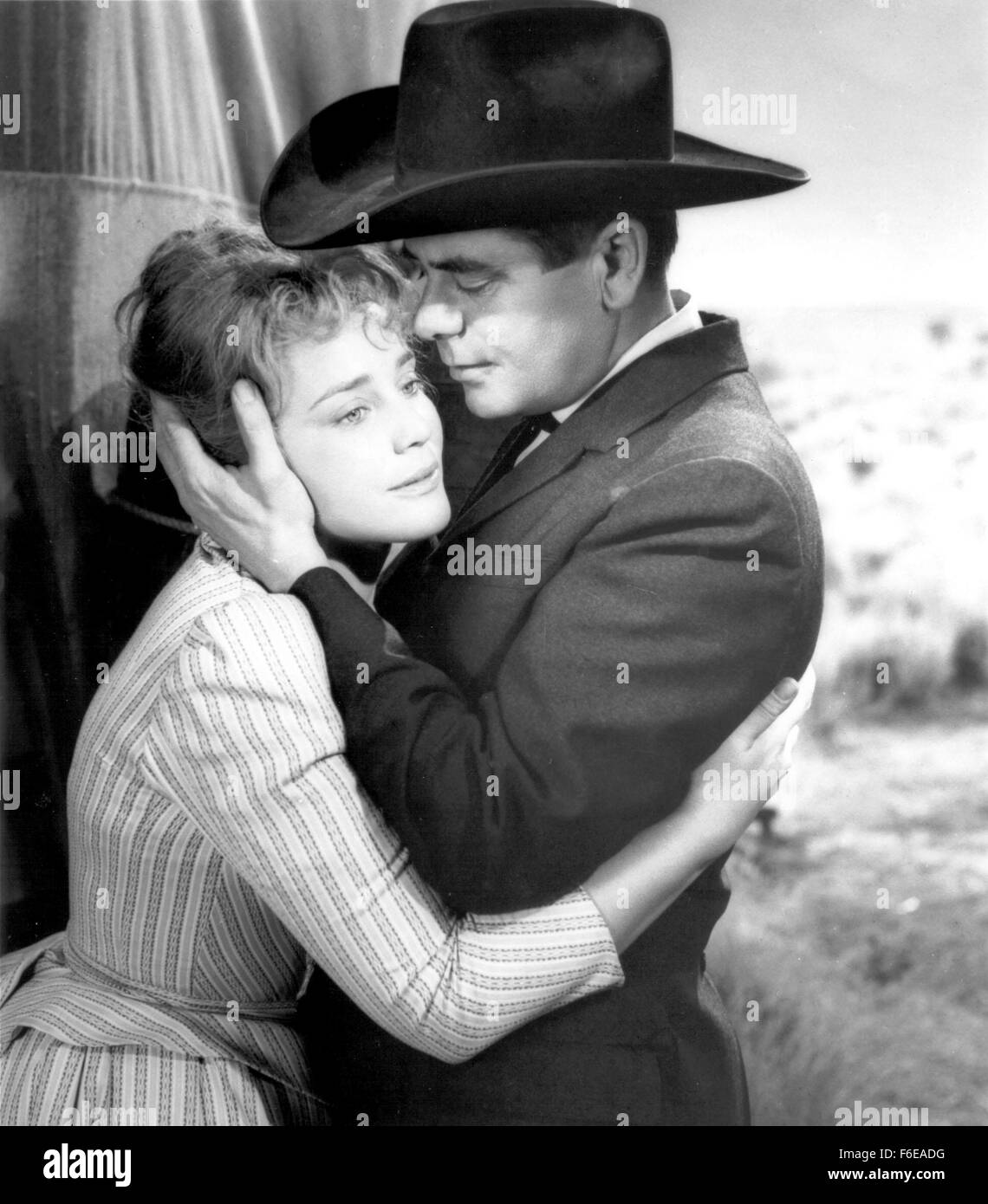 RELEASED: Dec, 1960 - Original Film Title: Cimarron - PICTURED: actor GLENN FORD stars as Yancey 'Cimarron' Cravatand with Austrian-born actress MARIA SCHELL. Stock Photo
