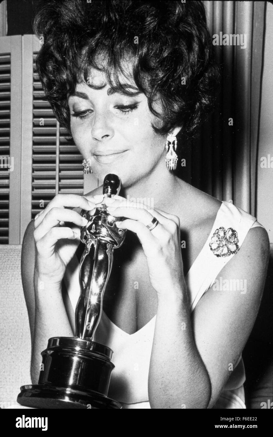 FILE PHOTO - ELIZABETH TAYLOR, 79, was born Feb. 27, 1932 in England. Liz a two time Oscar winning movie goddess and pioneering AIDS activist whose off-screen marriages (8), divorces and death defying exploits rivaled, her dramatic film roles. Dame Elizabeth Rosemond Taylor, the British - American icon, died March 23, 2011 of congestive heart failure, a stone's throw of the Hollywood sign. PICTURED - June 15, 1961 - Actress ELIZABETH TAYLOR smiles at her 1961 Oscar statuette for her role in 'Butterfield 8' during the Academy Awards in Los Angeles. Stock Photo