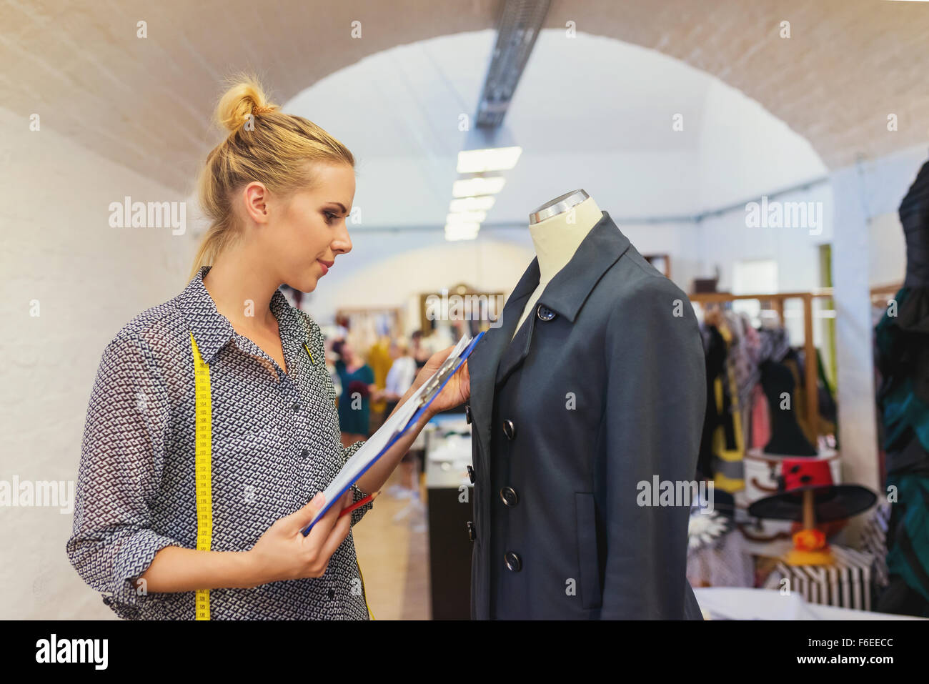 Check Measure Young woman checking measures Stock Photo - Alamy