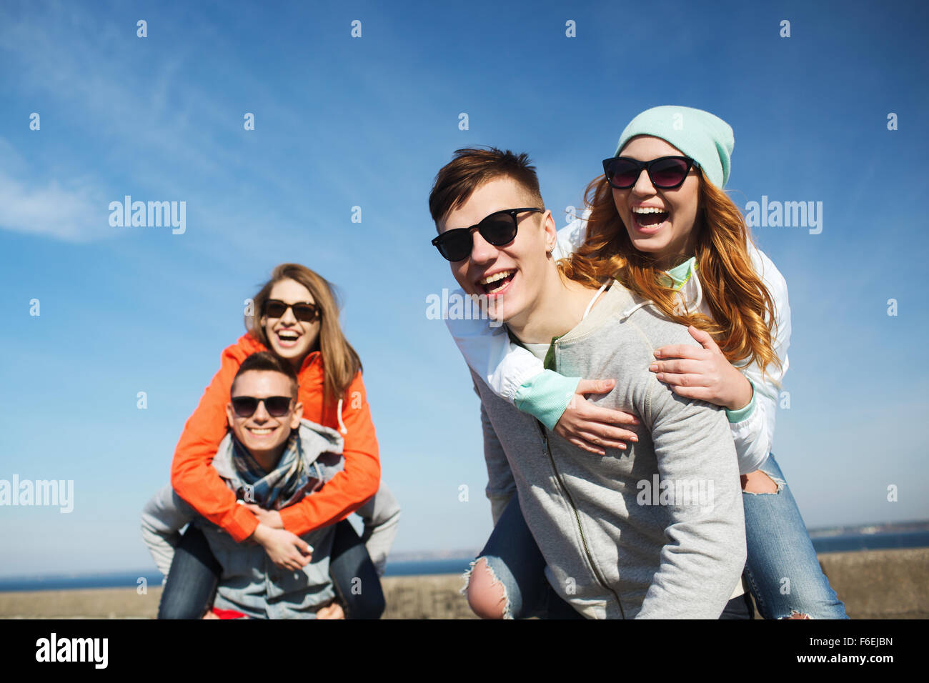 happy friends in shades having fun outdoors Stock Photo - Alamy