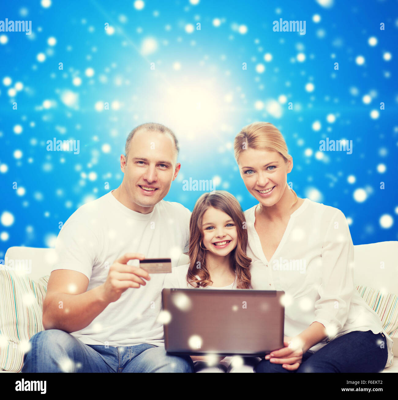 happy family with laptop computer and credit card Stock Photo - Alamy