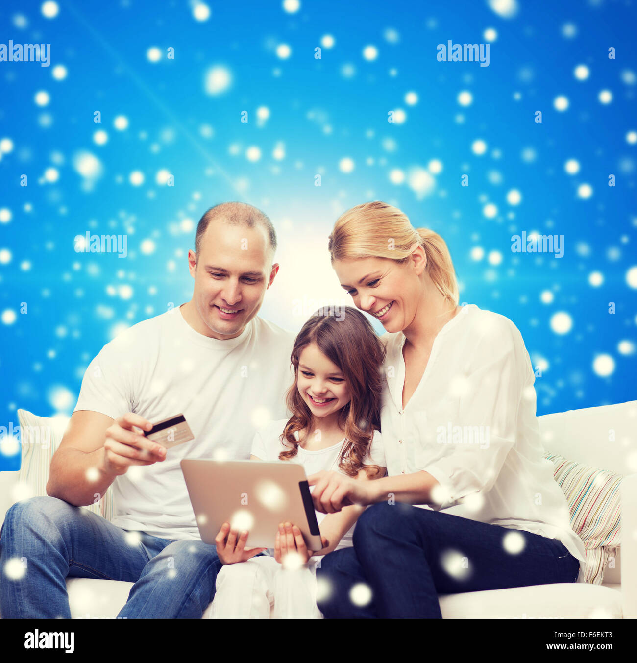 happy family with tablet pc and credit card Stock Photo