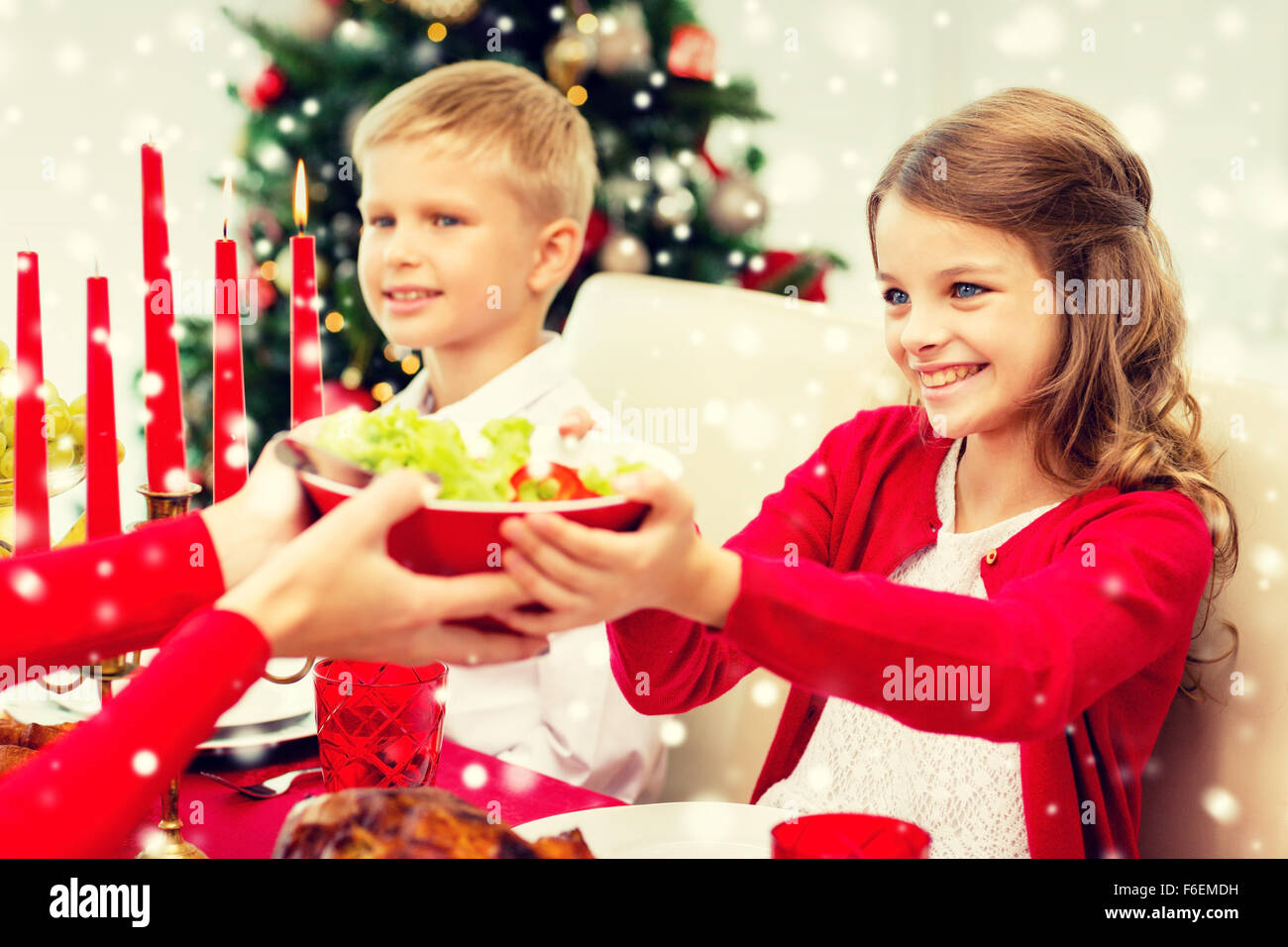 smiling family having holiday dinner at home Stock Photo - Alamy