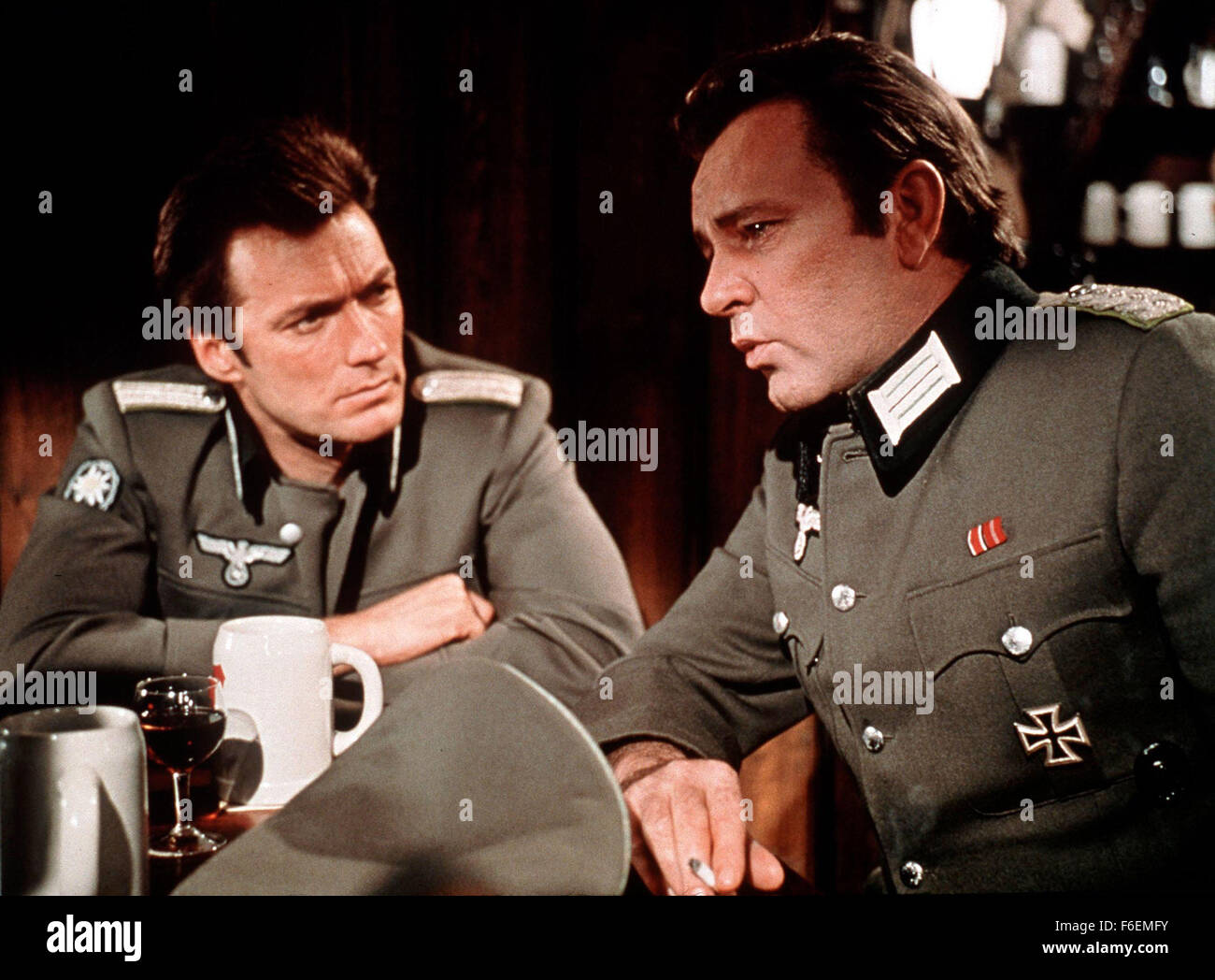 Dec 04, 1968; Hollywood, CA, USA; CLINT EASTWOOD (left) as Lt. Morris Schaffer and RICHARD BURTON as Maj. Jonathan Smith, MC in the action, war, adventure ''Where Eagles Dare'' directed by Brian G. Hutton. Stock Photo