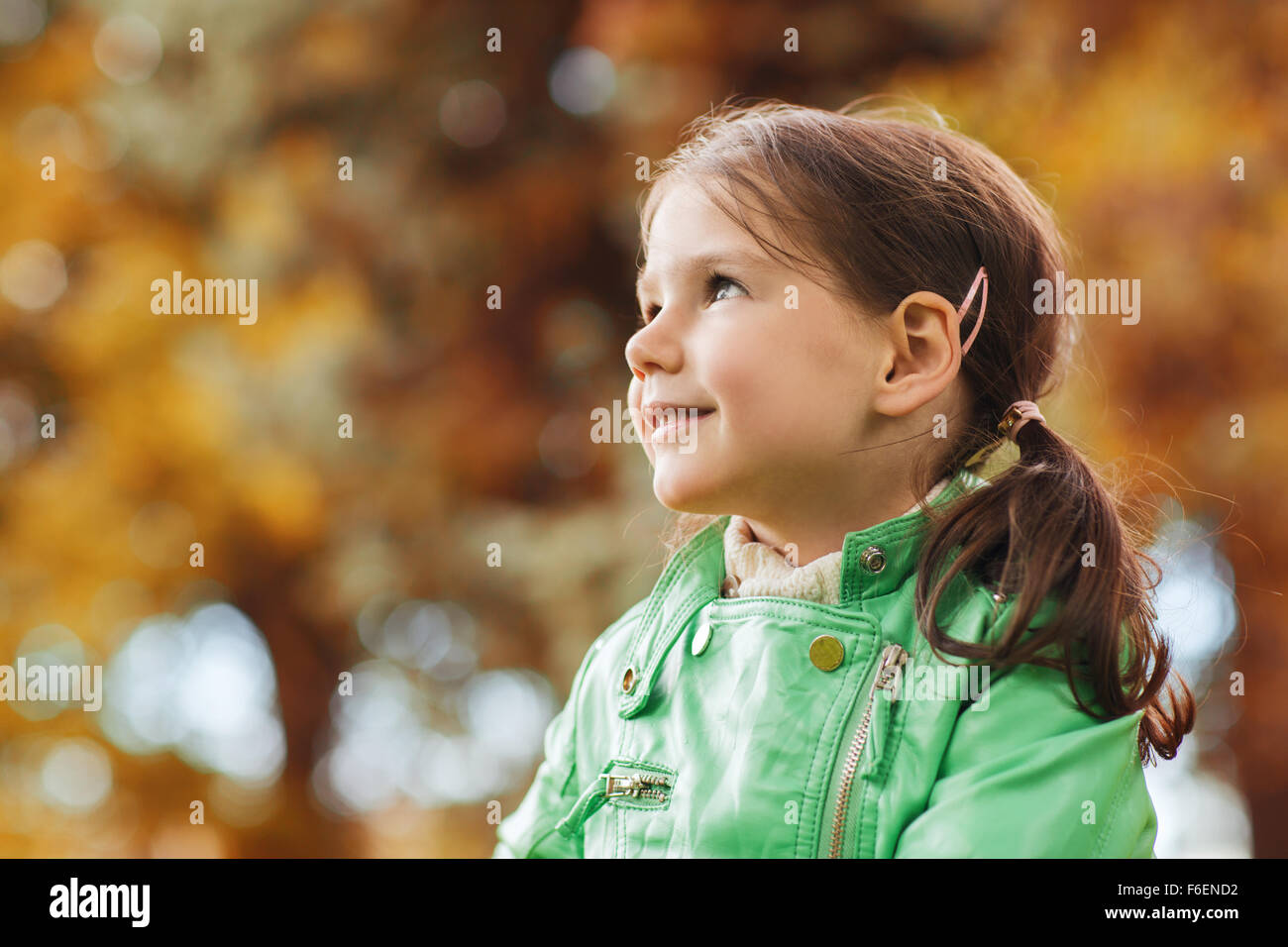 happy beautiful little girl portrait outdoors Stock Photo - Alamy