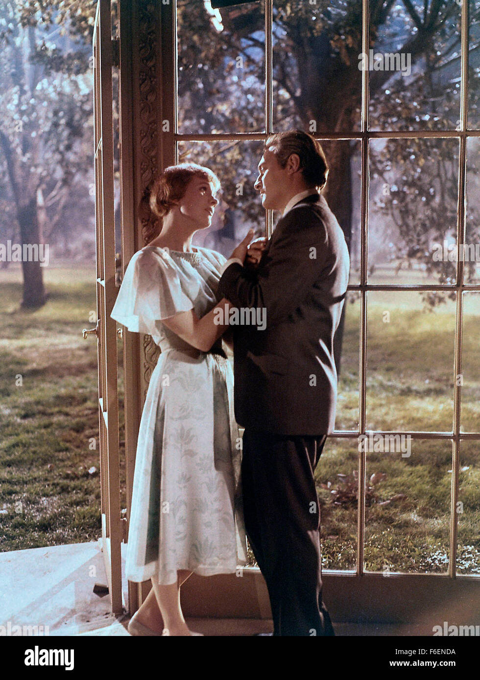 Film Title:  THE SOUND OF MUSIC.  DIRECTOR:  Robert Wise.  STUDIO:  20TH Century Fox.  PLOT:  Based on Baroness Maria von Trapp's 1949 autobiography,  the story follows a spirited young nun, Maria (Julie Andrews), who is sent to care for the seven unruly children of a militaristic, widowed Naval Captain (Christopher Plummer). She ultimately wins the hearts of the children - and the captain - but their lives are threatened by the encroachment of the Nazis on their beloved Austrian homeland.  Winner of 5 Academy Awards including:  Best Picture, Best Director (Wise), Music.  PICTURED:  JULIE ANDR Stock Photo