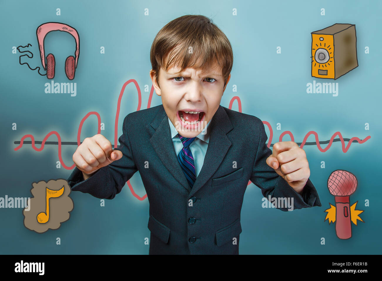Teen boy businessman clenched his fists and yelling mouth open f Stock Photo