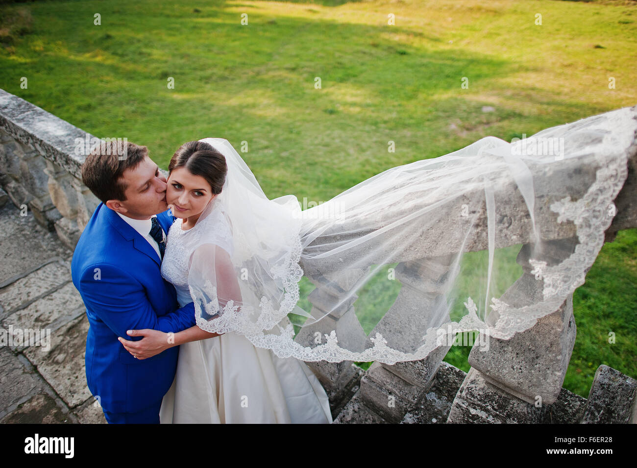 Young wedding couple on background old castle Stock Photo - Alamy