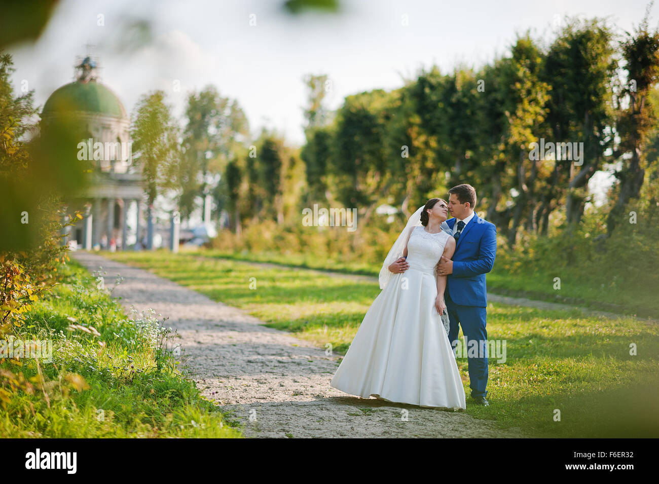 Young wedding couple on background old castle Stock Photo - Alamy