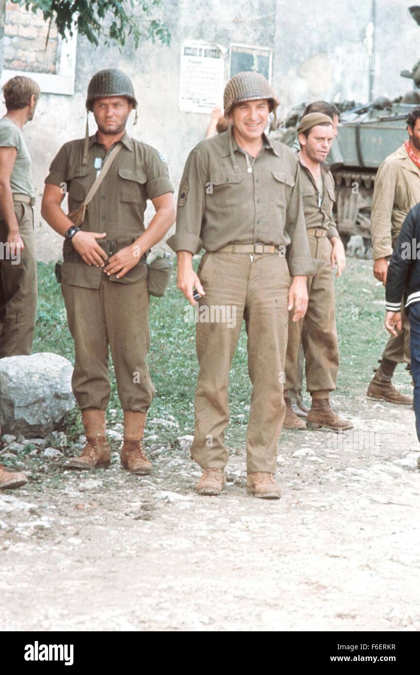 Apr 11, 1970; Hollywood, CA, USA; TELLY SAVALAS (center) as Master Sgt. Big Joe in the war, action, comedy ''Kelly's Heroes'' directed by Brian G. Hutton. Stock Photo