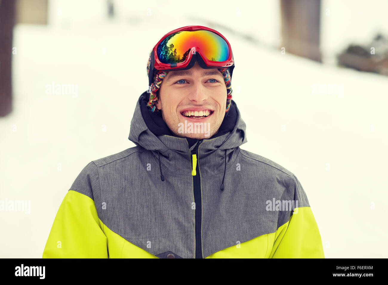 happy young man in ski goggles outdoors Stock Photo Alamy