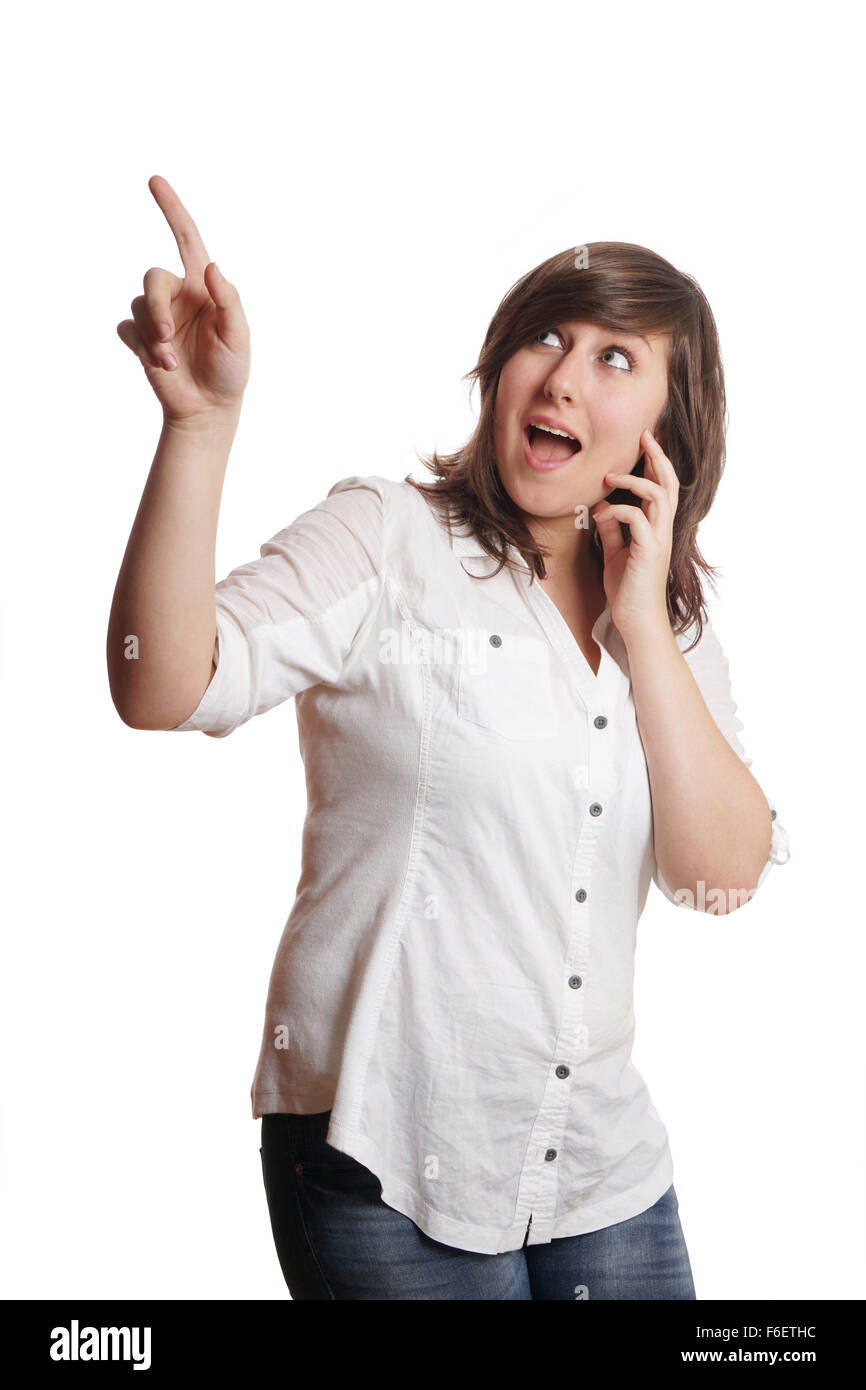 excited girl pointing upwards Stock Photo