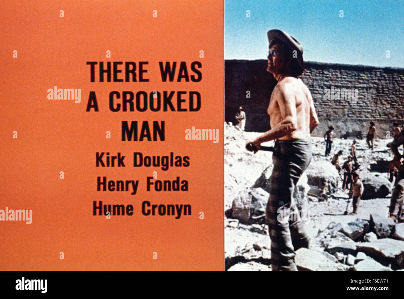 RELEASE DATE: December 25, 1970. MOVIE TITLE: There Was a Crooked Man. STUDIO: Warner Bros. Pictures. PLOT: Charm, intelligence and success in criminal career doesn't prevent Paris Pitman Jr. to start doing ten years in prison, in the middle of the Arizona desert. However, those years should pass quickly because of a $500,000 loot previously stashed away. New idealistic warden would only make Pitman think of getting his fortune even sooner. He starts to manipulate everyone to achieve his goal. PICTURED: KIRK DOUGLAS as Paris Pitman, Jr., HENRY FONDA as Woodward W. Lopeman and HUME CRONYN as Du Stock Photo