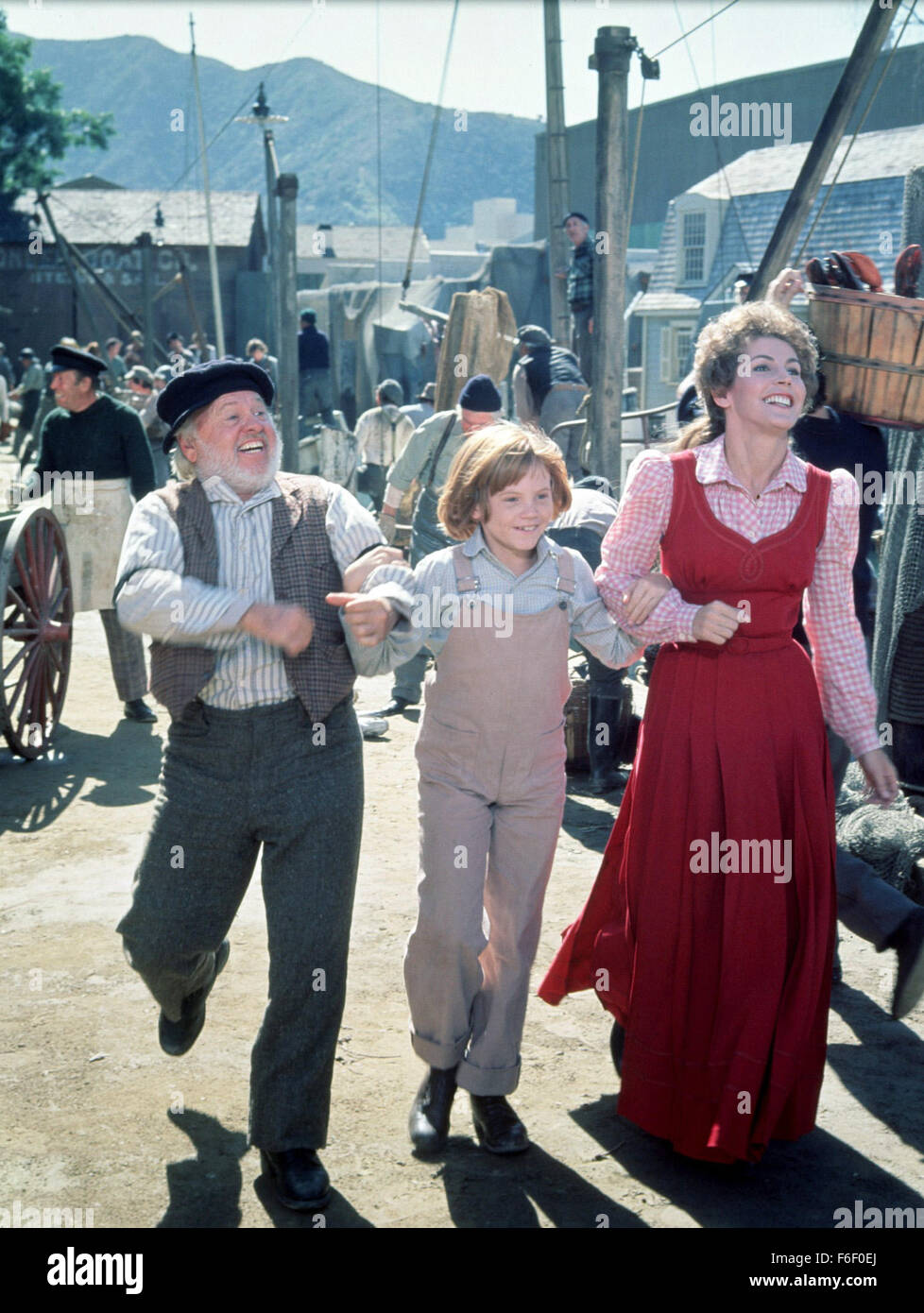 Nov 03, 1977; Hollywood, CA, USA; (left to right) MICKEY ROONEY as Lampie, SEAN MARSHALL as Pete, and HELEN REDDY as Nora in the family, animated, fantasy, musical ''Pete's Dragon'' directed by Don Chaffey. Stock Photo