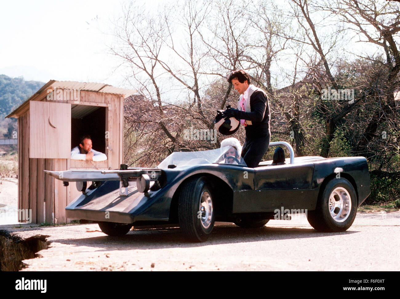 Apr 01, 1975; Los Angeles, CA, USA; SYLVESTER STALLONE (right) as Machine Gun Joe Viterbo in the action, sport, sci-fi film 'Death Race 2000' directed by Paul Bartel. Stock Photo