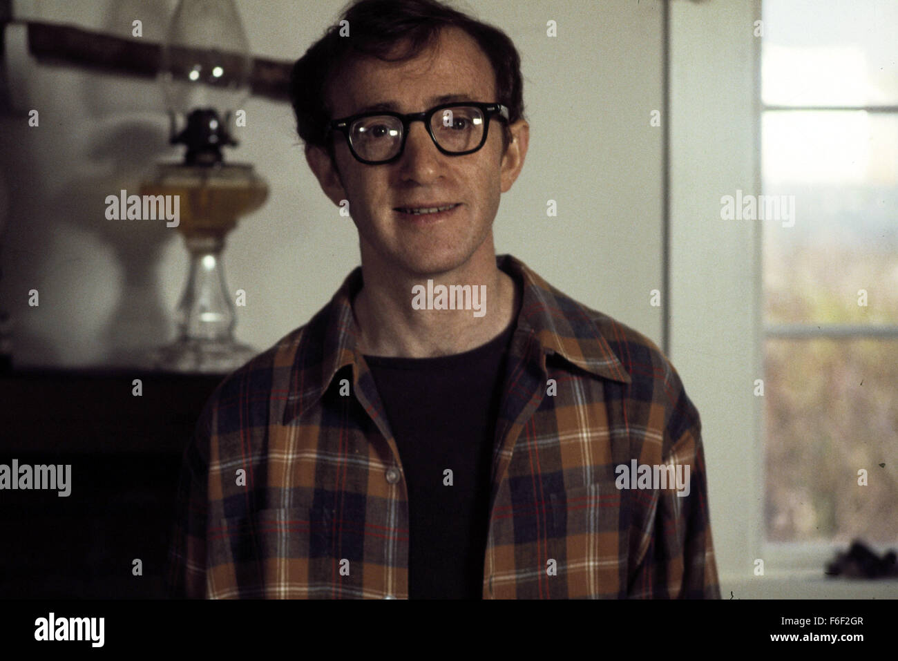 Film Title:  ANNIE HALL.  DIRECTOR:  Woody Allen.  STUDIO: UNITED ARTISTS  PLOT:    After breaking up with his girlfriend Annie Hall (Diane Keaton), neurotic comedian Alvy Singer (Woody Allen) goes on a stream of conciousness journey through his memories of their relationship, trying to find out what caused them to part ways. The film features innovative elements including cartoon segments, flashbacks, and even breaking the 'fourth wall' by having characters address the camera.  The  film marks the fourth pairing of Keaton and Allen, who were also an off-screen couple at the time.  Winner of 4 Stock Photo