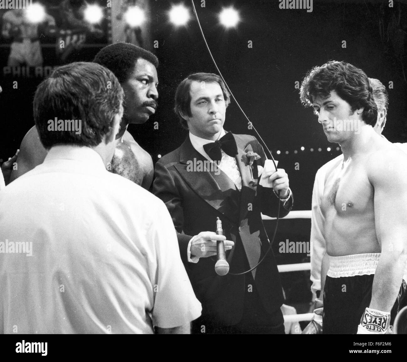 Jun 15, 1979; Philadelphia, PA, USA; CARL WEATHERS (back left) as Apollo Creed and SYLVESTER STALLONE (back right) as Rocky Balboa in the action, sport, drama 'Rocky II' directed by Sylvester Stallone. Stock Photo