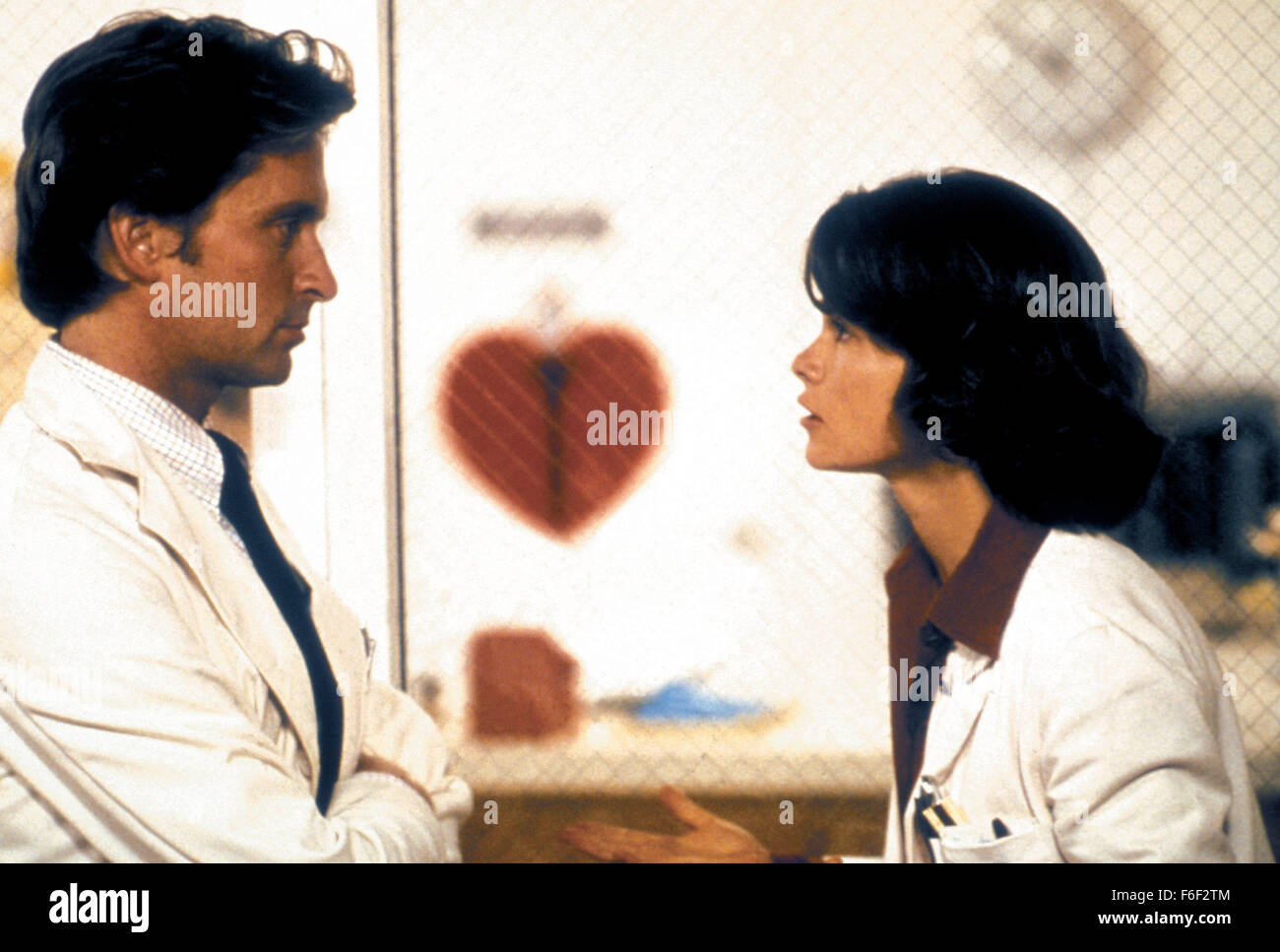 Jan 06, 1978; Los Angeles, CA, USA; MICHAEL DOUGLAS as Dr. Mark Bellows and GENEVIEVE BUJOLD as Dr Susan Wheeler in the mystery thriller film 'Coma' directed by Michael Crichton. Stock Photo