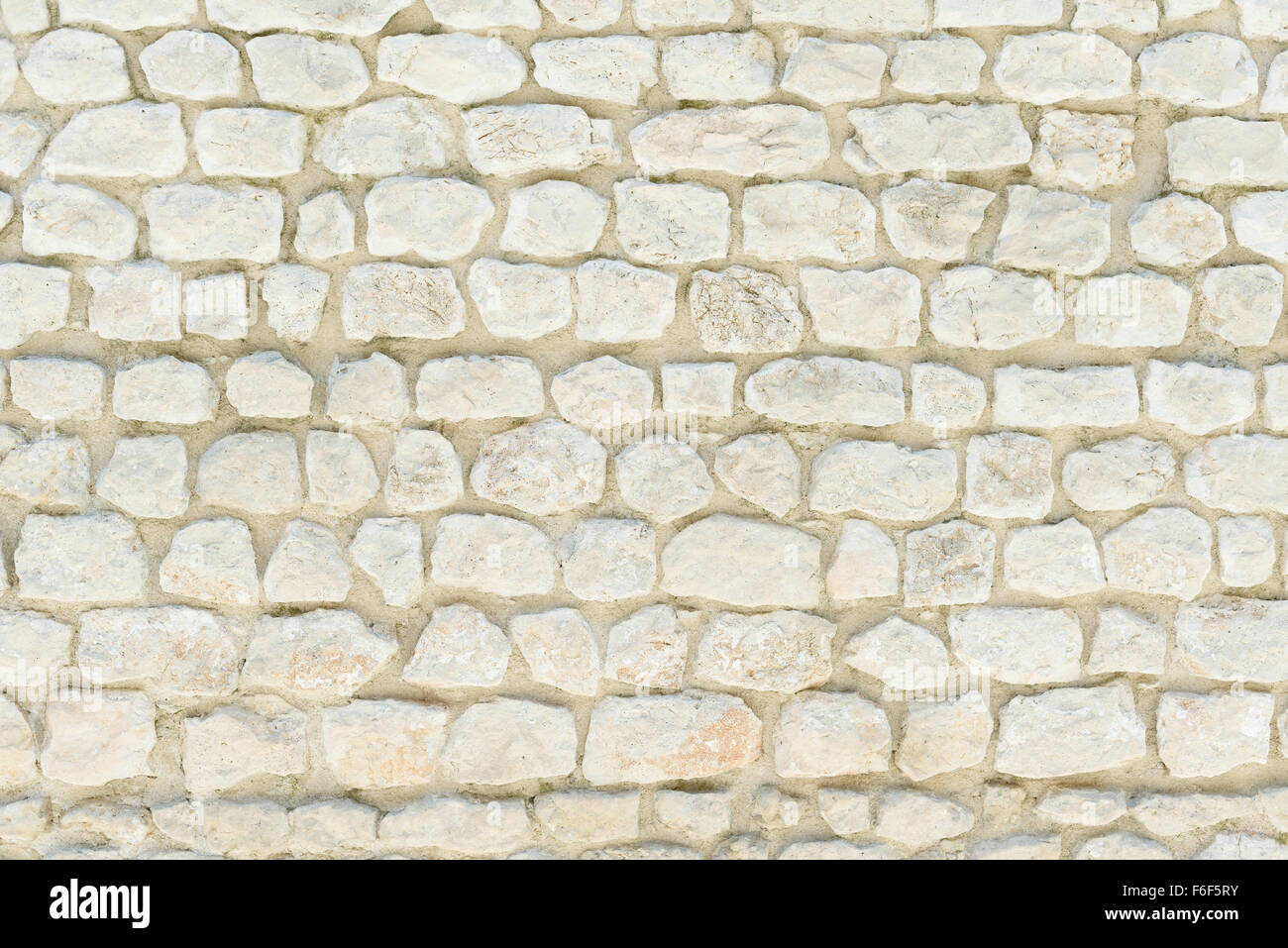 Stone wall background, pattern, texture, wallpaper. Traditional construction in Provence, Cote Azur, France, Europe. Stock Photo