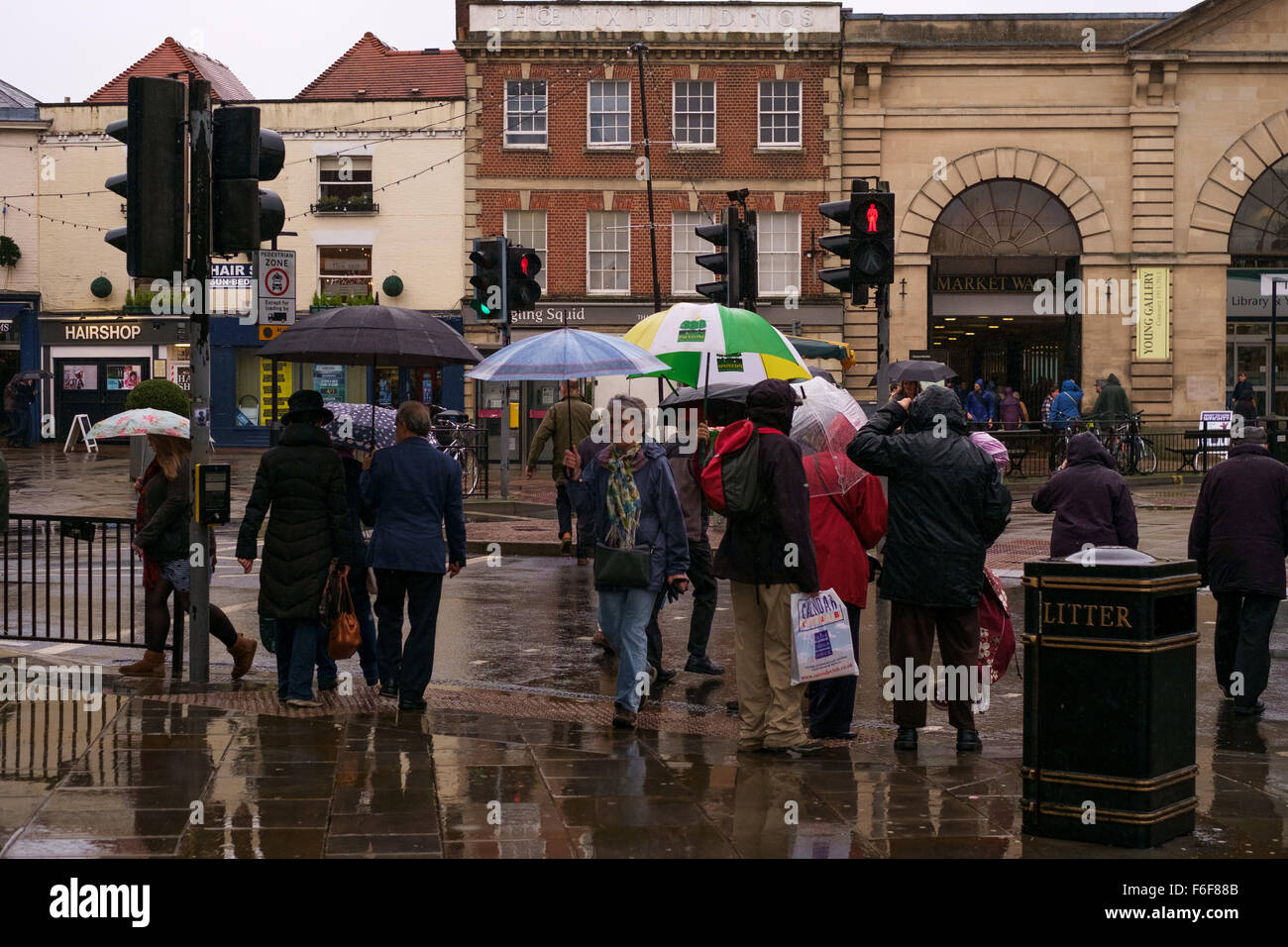 Uk Weather A Very Wet Day For Shopping In Salisbury With People Crossing The Road Using Umbrellas To Protect Them From Heavy Rain Uk Weather A Very Wet Day For Shopping In Salisbury With People Crossing The Road Using Umbrellas To Protect Them From Heavy Rain