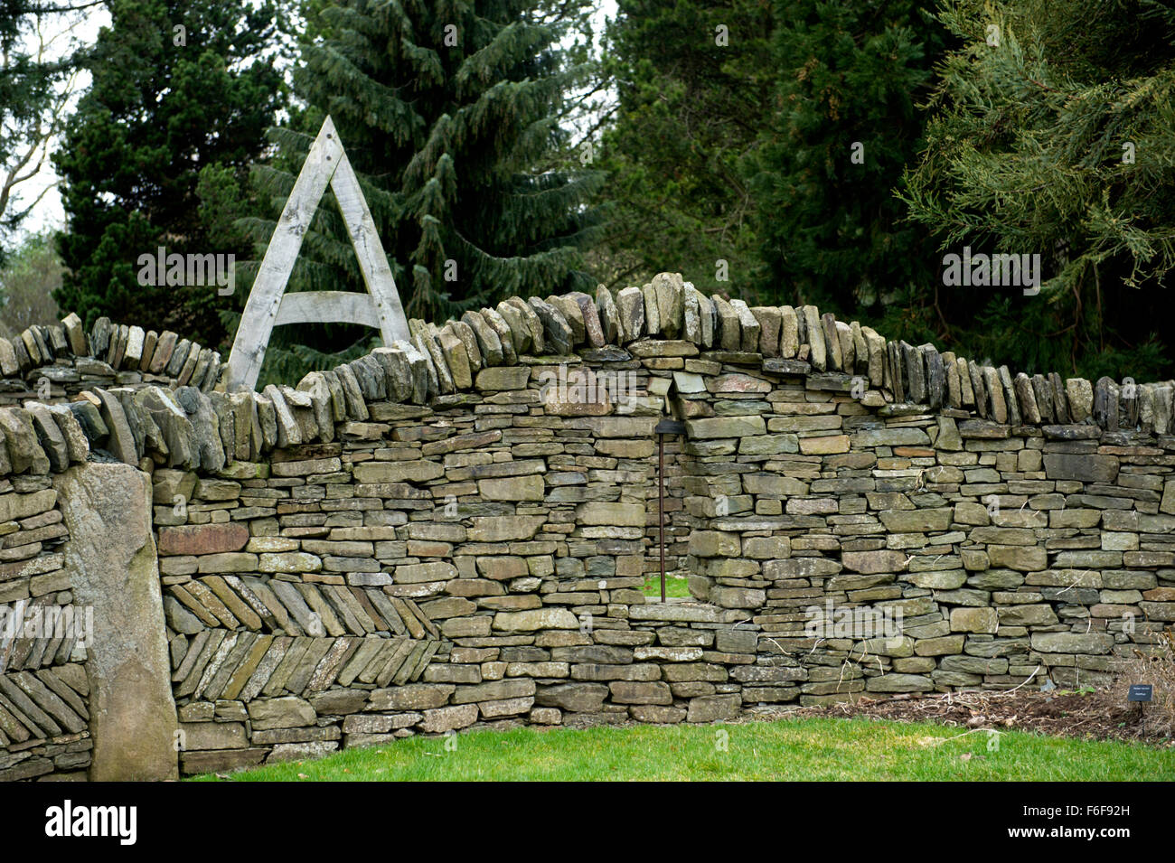 Oak A frame and slate dry stone wall provide picturesque and rustic features in a garden Stock Photo