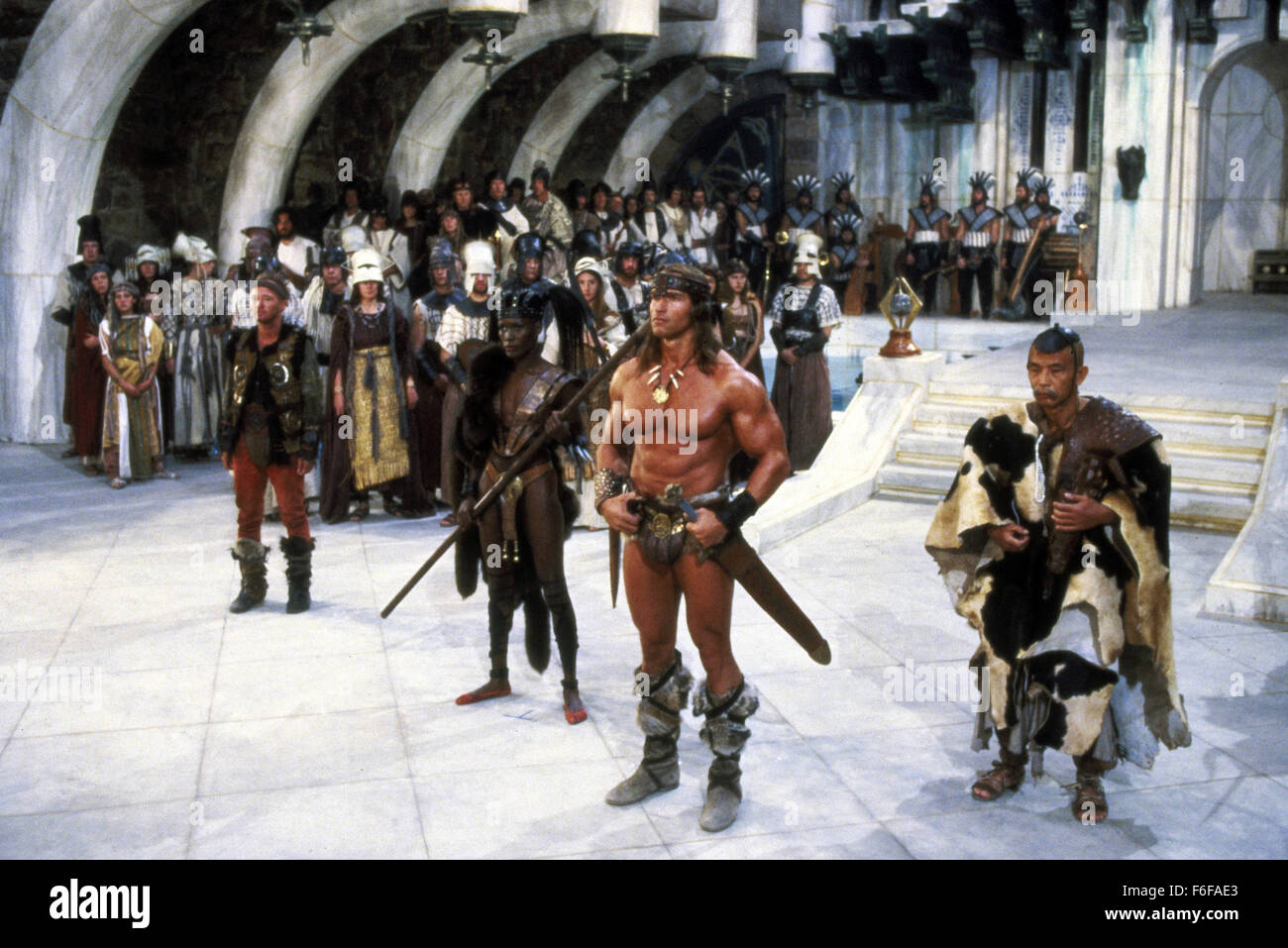 RELEASE DATE: June 29, 1984  MOVIE TITLE: Conan the Destroyer  DIRECTOR: Richard Fleischer   STUDIO: De Laurentiis  PLOT: The wandering barbarian, Conan, alongside his goofy rogue pal, Malak, are tasked with escorting Queen Taramis' virgin niece, Princess Jehnna and her bodyguard, Bombaata, to a mystical island fortress. They must retrieve a magical crystal that legends say can awaken the god of dreams, Dagoth. Along the way, Conan reunites with the wise wizard, Akiro and befriends the fierce female fighter, Zula  PICTURED: ARNOLD SCHWARZENEGGER as Conan and MAKO as Akiro  (Credit Image: c De Stock Photo