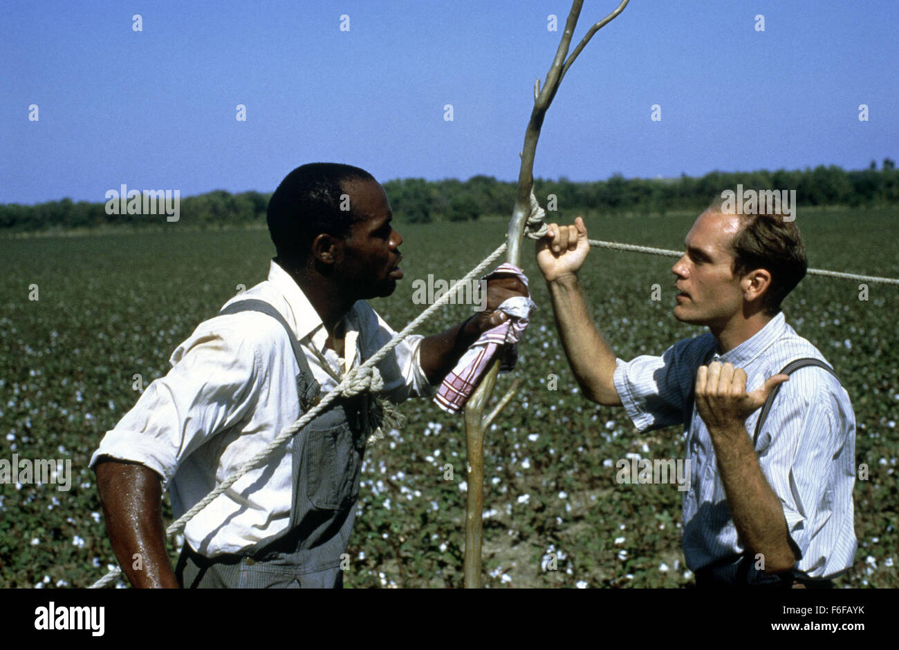 Sep 10, 1984; Hollywood, CA, USA;  JOHN MALKOVICH (Right) and DANNY GLOVER (Left) star as Mr. Will and Moze in the drama 'Places in the Heart' directed by Robert Benton. Stock Photo