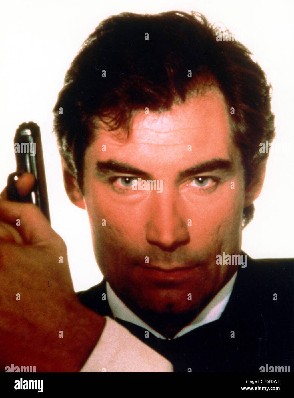 RELEASE DATE: June 29, 1987. Film Title: The Living Daylights. STUDIO: 20th Century Fox. PLOT: James Bond finds himself helping a Soviet general escape from the Iron Curtain only to see a cellist holding a rifle on his subject. When the general is recaptured, Bond decides to track him by finding out why a concert cello player would try and kill her benefactor. He escapes with her first to Vienna, then to Morocco, finally ending up in a prison in Soviet occupied Afghanistan as he tracks down the elements in this mystery. PICTURED: TIMOTHY DALTON as James Bond. Stock Photo