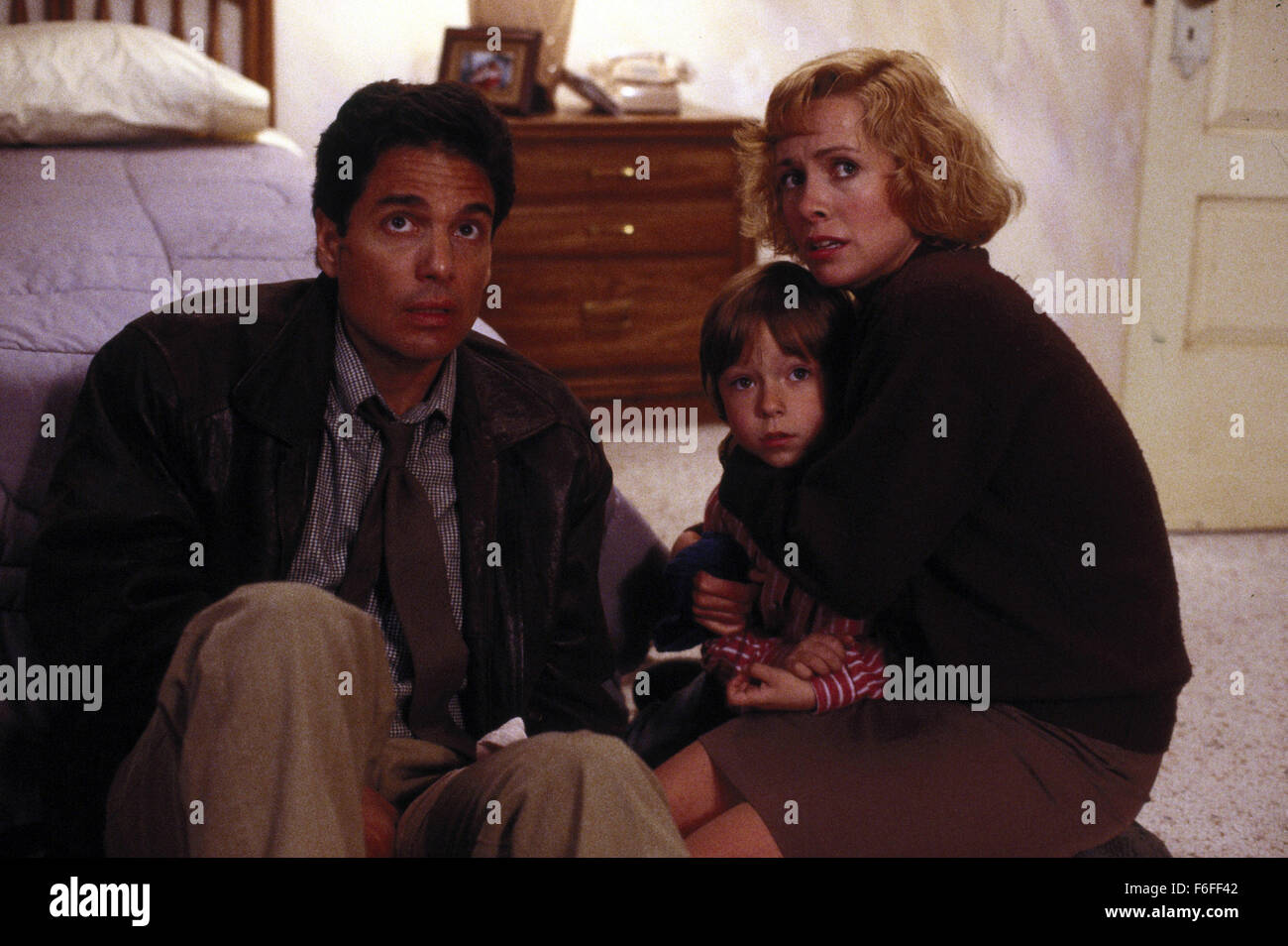Nov 08, 1988; Chicago, IL, USA; (left to right) CHRIS SARANDON as Mike Norris, ALEX VINCENT as Andy Barclay, and CATHERINE HICKS as Karen Barclay in the horror film 'Child's Play' directed by Tom Holland. Stock Photo