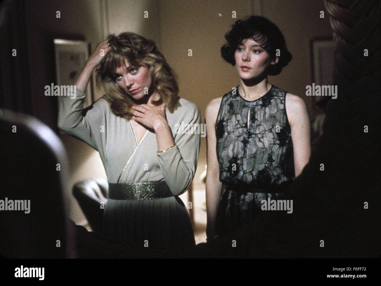 Mar 11, 1988; Los Angeles, CA, USA; Actress MEG TILLY (right) stars as Olivia Lawrence and KIM CATTRALL as Brooke Morrison in the Bob Swaim directed romantic thriller, 'Masquerade.' Stock Photo