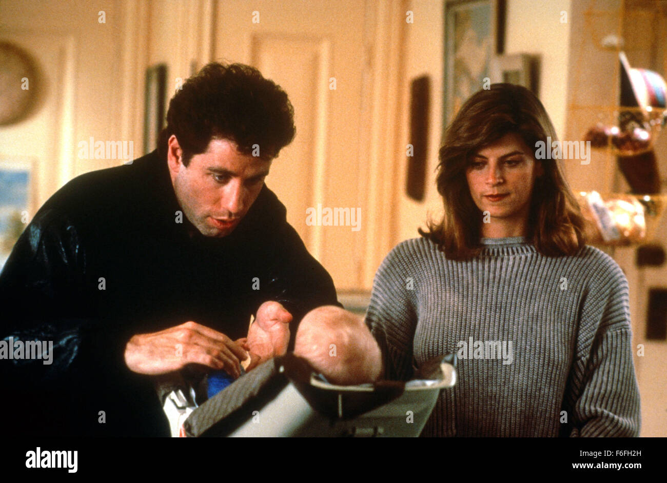 Aug 17, 1989; Hollywood, CA, USA; KIRSTIE ALLEY and JOHN TRAVOLTA star as Mollie and James Ubriacco in the romantic comedy 'Look Who's Talking' directed by Amy Heckerling Stock Photo
