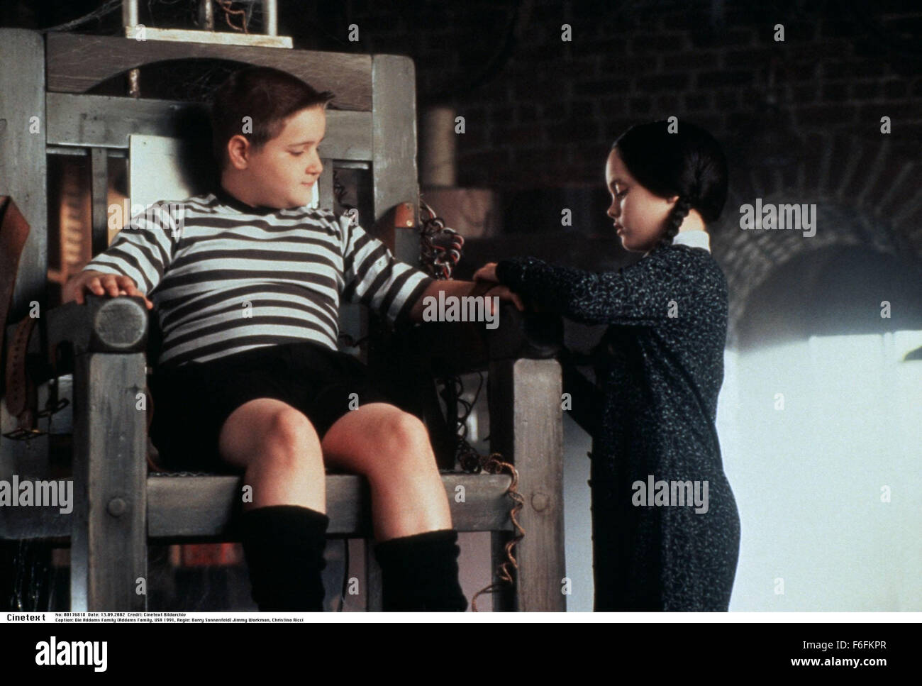 RELEASE DATE: 22 November 1991. MOVIE TITLE: The Addams Family - STUDIO: Paramount Pictures. PLOT: Con artists plan to fleece the eccentric family using an accomplice who claims to be their long lost Uncle Fester. PICTURED: JIMMY WORKMAN as Pugsley Addams and CHRISTINA RICCI as Wednesday Addams. Stock Photo
