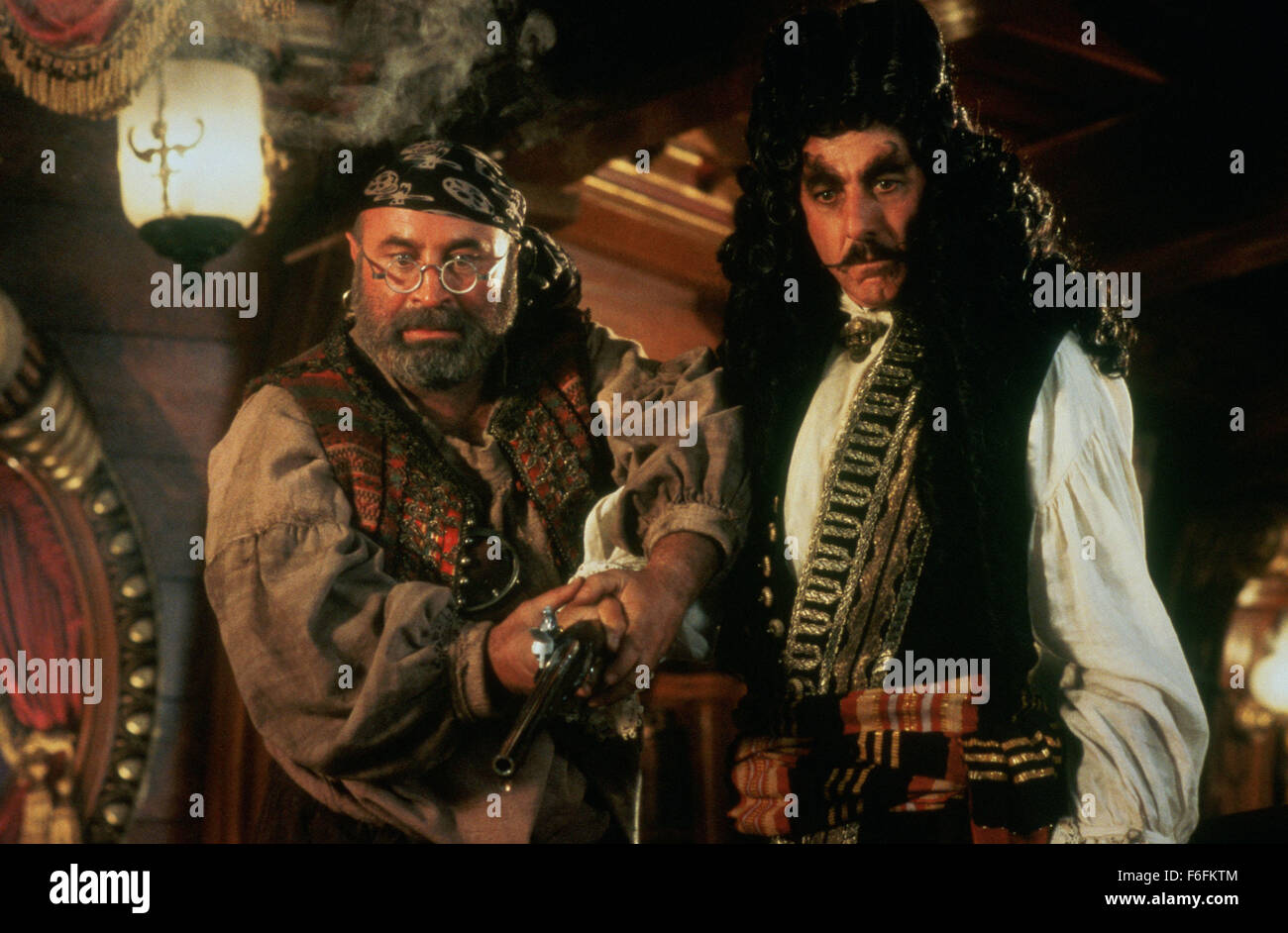 RELEASE DATE: 11 December 1991. MOVIE TITLE: Hook - STUDIO: TriStar Pictures. PLOT: When Capt. Hook kidnaps his children, an adult Peter Pan must return to Neverland and reclaim his youthful spirit in order to challenge his old enemy. PICTURED: BOB HOSKINS as Smee and DUSTIN HOFFMAN as Capt. Hook. Stock Photo
