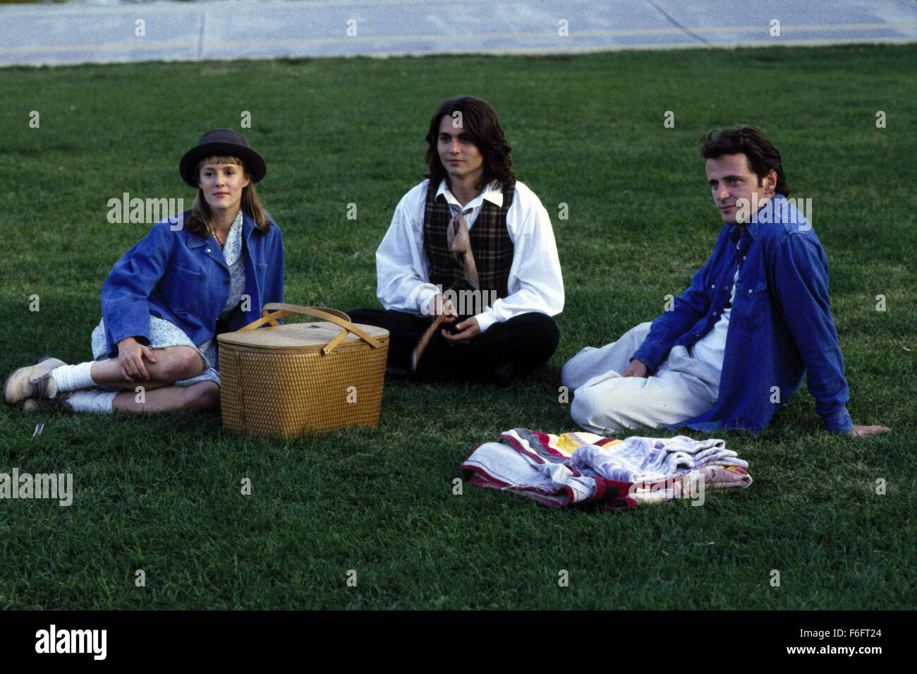 Apr 16, 1993; Spokane, WA, USA; (left to right) MARY STUART MASTERSON as Juniper 'Joon' Pearl, JOHNNY DEPP as Sam, and AIDAN QUINN as Benjamin 'Benny' Pearl in the comic, romance, drama 'Benny and Joon' directed by Jeremiah S. Chechik. Stock Photo