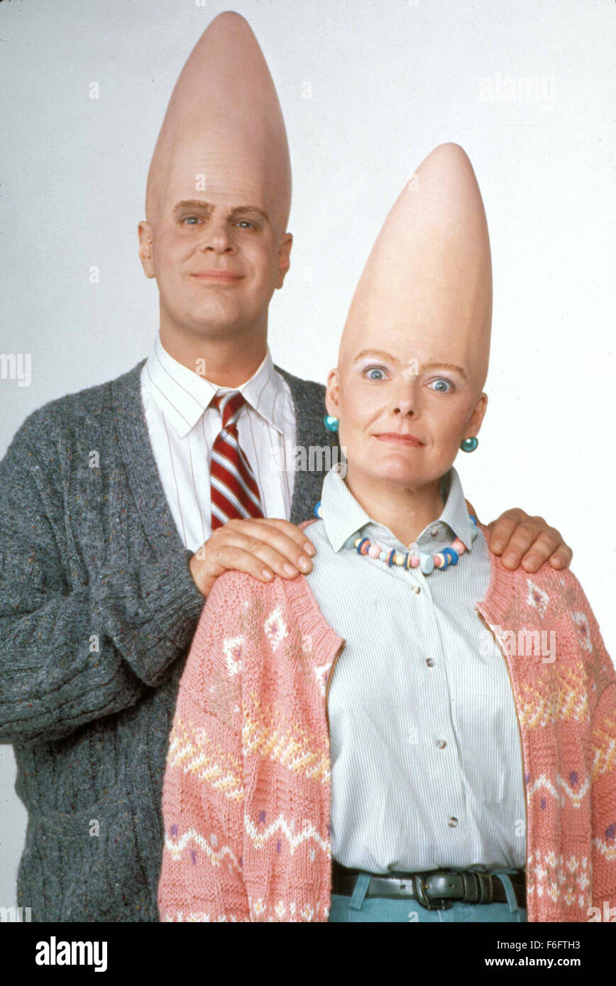 RELEASE DATE: July 23, 1993. MOVIE TITLE: Coneheads. STUDIO: Paramount Pictures. PLOT: An alien couple with cone-shaped heads from the planet 'Remulak' is mistakingly ditched on earth. While waiting to be recalled to their mother planet, they start a family and have a little daughter. They try to adapt to earth customs by living in middle-class suburbia. Meanwhile, their daughter grows up to be a teenager who has difficulties fitting in with her peers or accepting the fact that at some point, she has to return to 'Remulak' with the rest of the family. PICTURED: DAN AYKROYD as Beldar Conehead , Stock Photo