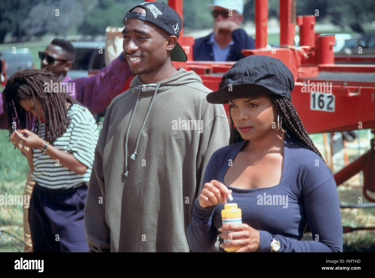 RELEASE DATE: 23 July 1993. MOVIE TITLE: Poetic Justice. STUDIO: Columbia Pictures Corporation. PLOT: In this film, we see the world through the eyes of main character Justice, a young African-American poet. PICTURED: TUPAC SHAKUR as Lucky and JANET JACKSON as Justice. Stock Photo