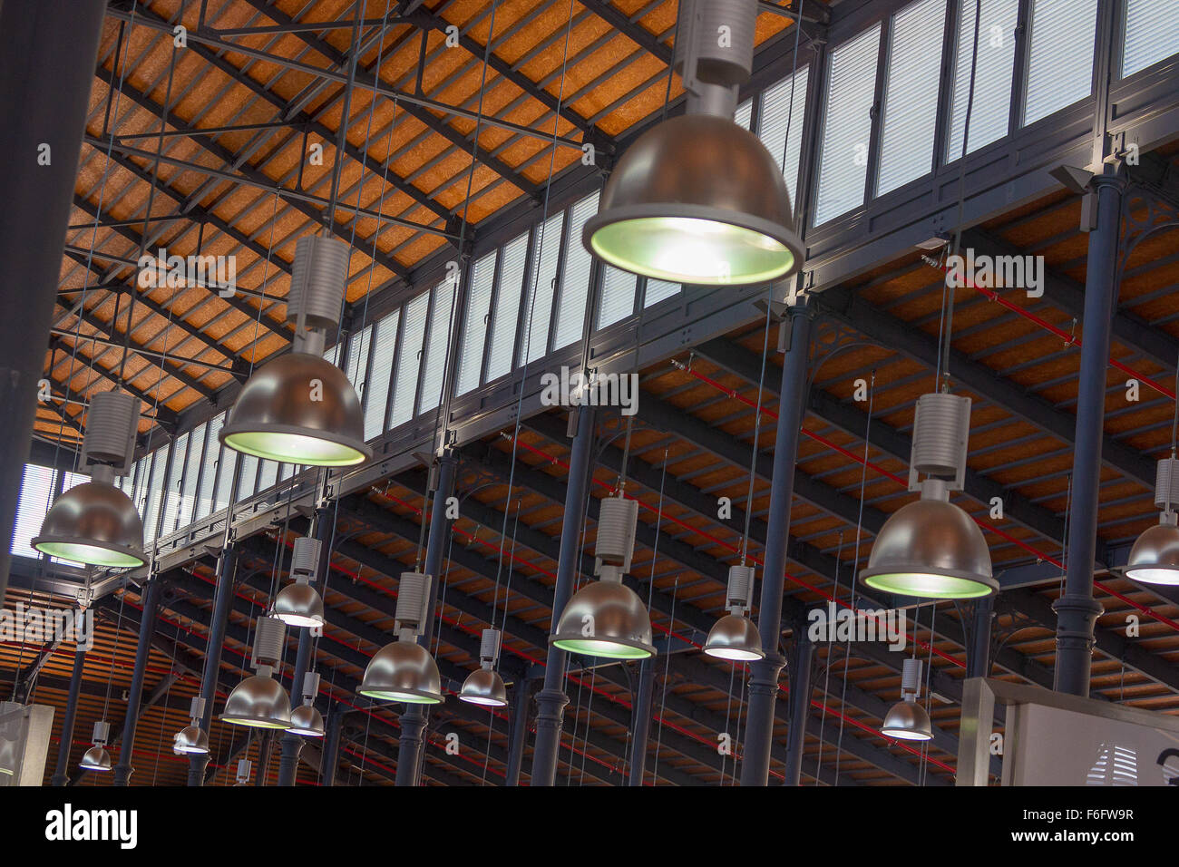 modern lights hanging from an old wooden roof Stock Photo - Alamy