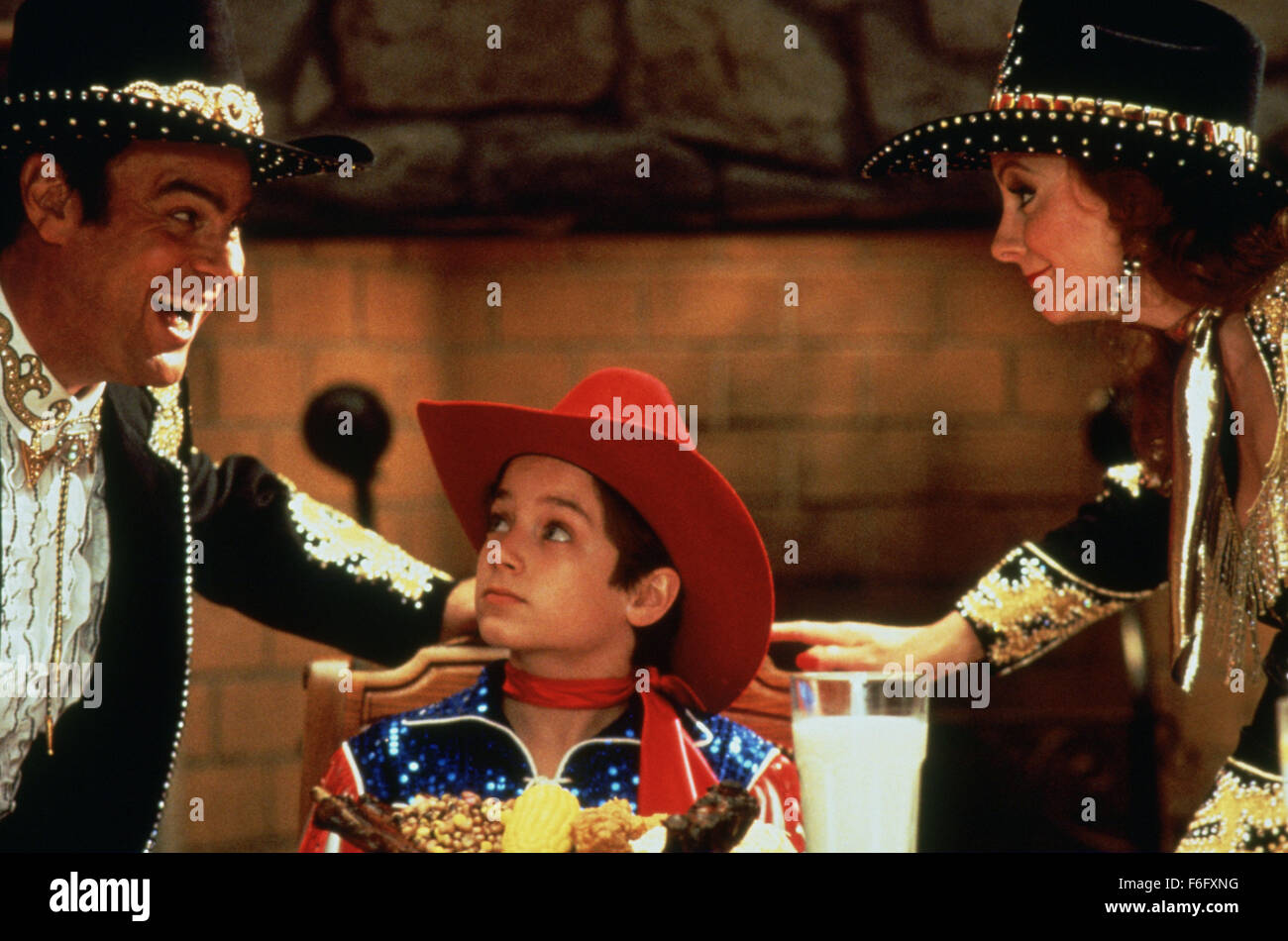 RELEASE DATE: 22 July 1994. MOVIE TITLE: North STUDIO: Castle Rock Entertainment. PLOT: Eleven year old North has had it with his parents. They are always busy with their careers and don't give North the attention he needs, so he files a lawsuit against them. PICTURED: DAN AYKROYD as Pa Tex with ELIJAH WOOD as North and REBA MCENTIRE as Ma Tex. Stock Photo