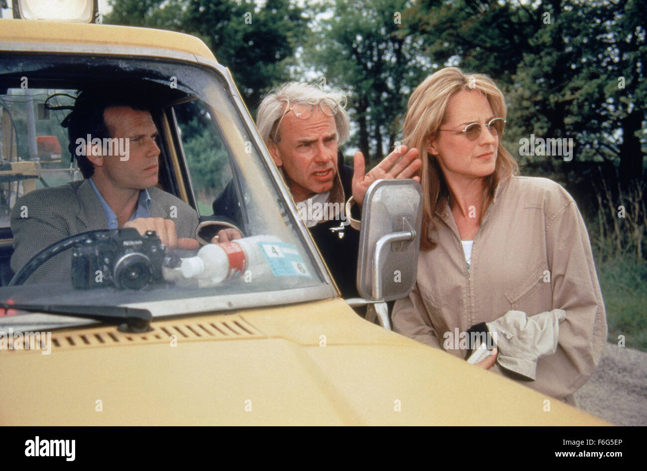 RELEASE DATE: 10 May 1996. MOVIE TITLE: Twister STUDIO: Universal Pictures. PLOT: A couple on the point of divorce keep meeting each other because both are researchers who chase tornadoes. PICTURED: BILL PAXTON as Bill Harding with Director JAN DE BONT and HELEN HUNT as Dr. Jo Harding. Stock Photo