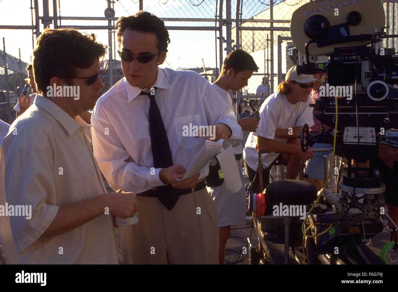 Jun 06, 1997; Los Angeles, CA, USA; Actor JOHN CUSACK with director SIMON WEST on the set of 'Con Air.' Stock Photo