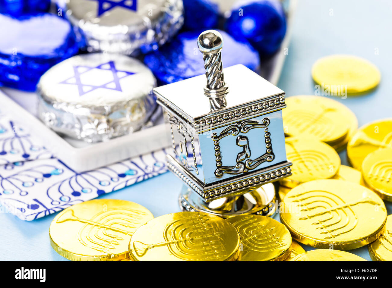 Hanukkah dreidel and gelt on the table Stock Photo - Alamy