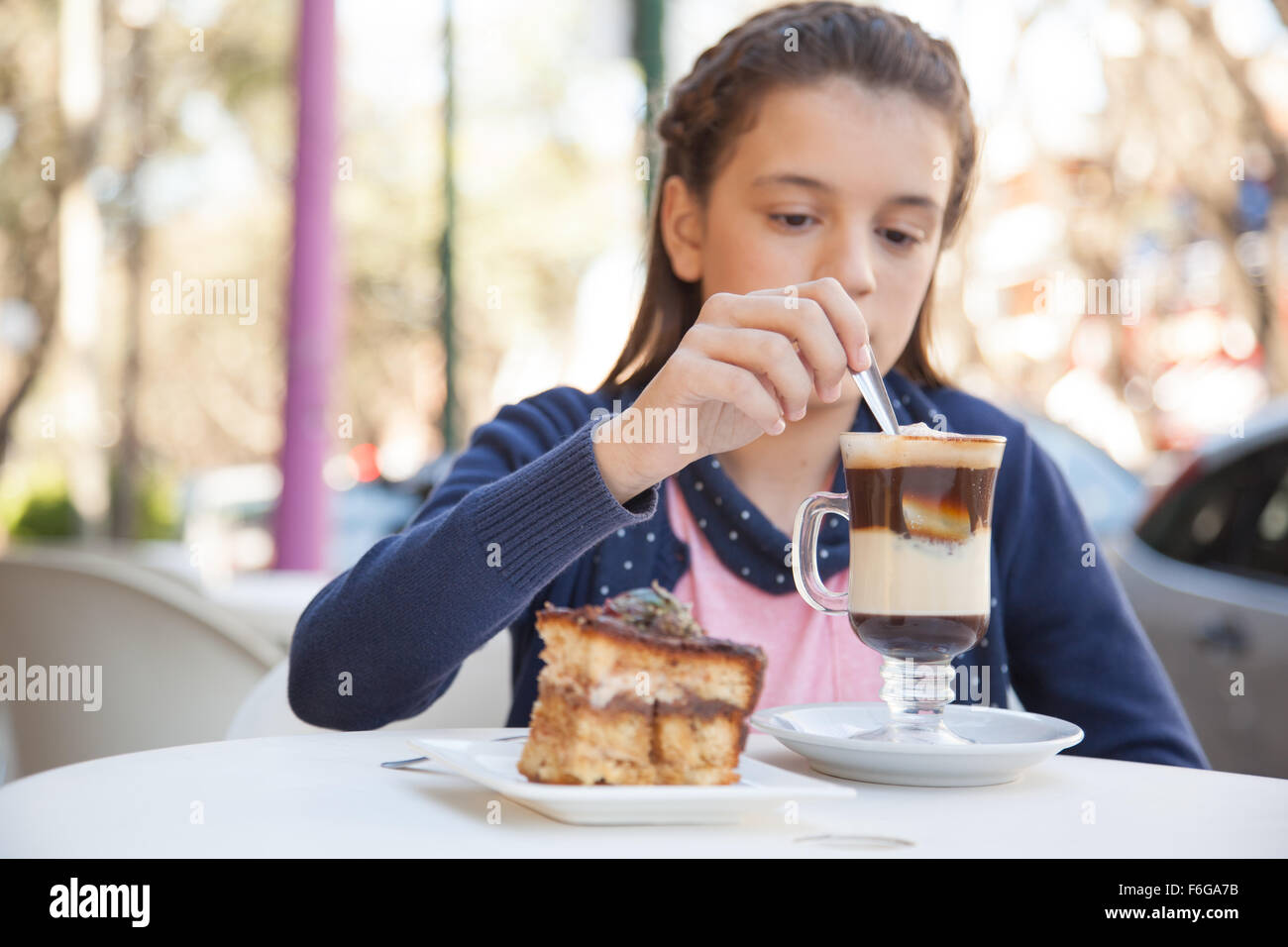 Girl drinking a cup of coffee Stock Photo