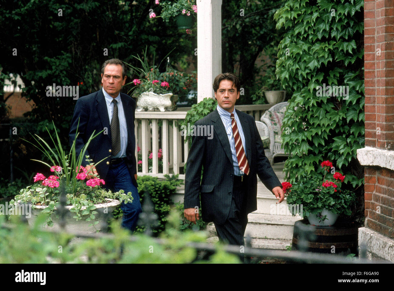 RELEASE DATE: 6 March 1998. MOVIE TITLE: U.S. Marshals STUDIO: Kopelson Entertainment. PLOT: US Marshal Samuel Gerard and his team of Marshals are assigned to track down Sheridan, a murderer and robber. PICTURED: TOMMY LEE JONES as Chief Deputy Marshal Samuel Gerard and ROBERT DOWNEY JR. as Special Agent John Royce. Stock Photo