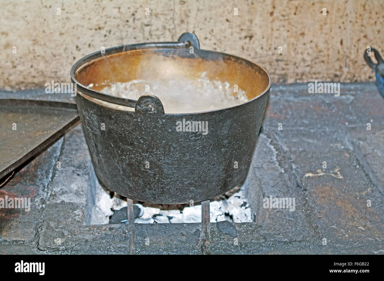 Tudor Life Boiling Saucepan on Stove on Log Fire Kentwell Hall Suffolk